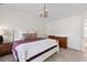 Cozy bedroom with vaulted ceiling, chandelier, carpeted floors, and comfortable furnishings at 407 Burton Ave, Summerville, SC 29485