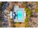 Aerial view shows a well-maintained community pool surrounded by trees and lounge chairs at 407 Burton Ave, Summerville, SC 29485