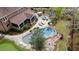 Aerial view of a well-maintained backyard with a sparkling pool, outdoor seating, and a lush green lawn at 4217 Sawgrass Dr, Charleston, SC 29420