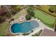 Overhead shot of a backyard with a kidney-shaped pool, putting green, waterfall feature, and manicured landscaping at 4217 Sawgrass Dr, Charleston, SC 29420