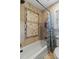 Elegant bathroom features a white bathtub with decorative tile and blue patterned curtain at 4217 Sawgrass Dr, Charleston, SC 29420