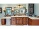 Bathroom featuring dual vanities, tile backsplash, and large mirrors at 4217 Sawgrass Dr, Charleston, SC 29420