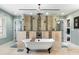 Luxurious bathroom with dual walk-in shower, soaking tub, and travertine tile at 4217 Sawgrass Dr, Charleston, SC 29420