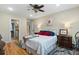 Inviting bedroom boasts hardwood floors, a ceiling fan, and ample natural light at 4217 Sawgrass Dr, Charleston, SC 29420