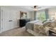 Cozy bedroom with carpet, ceiling fan, large bed, and a window for natural light at 4217 Sawgrass Dr, Charleston, SC 29420