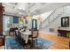 Inviting dining room with chandelier, hardwood floors, and staircase visible in an open floor plan at 4217 Sawgrass Dr, Charleston, SC 29420