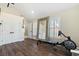 Exercise room features hardwood floors, a large mirror, and ample natural light at 4217 Sawgrass Dr, Charleston, SC 29420