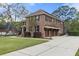 Beautiful two-story brick home with a three-car garage and well-maintained landscaping at 4217 Sawgrass Dr, Charleston, SC 29420