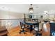 Spacious game room with a pool table, poker table, and comfortable seating area at 4217 Sawgrass Dr, Charleston, SC 29420
