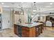 Spacious kitchen island with marble countertop, wine cooler, and custom wood cabinetry at 4217 Sawgrass Dr, Charleston, SC 29420