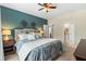Inviting main bedroom featuring an en-suite bathroom, ceiling fan, and walk-in closets at 4217 Sawgrass Dr, Charleston, SC 29420