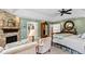 Main bedroom with a stone fireplace and sitting area at 4217 Sawgrass Dr, Charleston, SC 29420
