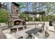 Outdoor stone fireplace with a seating area, ideal for enjoying cozy evenings in a tranquil setting at 4217 Sawgrass Dr, Charleston, SC 29420