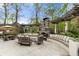Beautiful outdoor patio with a stone fireplace, pergola, and comfortable seating, perfect for gatherings at 4217 Sawgrass Dr, Charleston, SC 29420