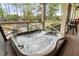 Inviting hot tub on screened porch with outdoor view of pool and manicured lawn at 4217 Sawgrass Dr, Charleston, SC 29420