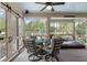 Outdoor porch with a hot tub, seating area, overhead fans, and beautiful backyard views at 4217 Sawgrass Dr, Charleston, SC 29420