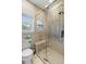 Modern bathroom featuring a walk-in shower with glass door, built-in seat, and designer tile at 4217 Sawgrass Dr, Charleston, SC 29420