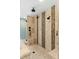 Spacious walk-in shower features multiple shower heads, tiled walls, and a built-in bench at 4217 Sawgrass Dr, Charleston, SC 29420