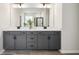 Modern bathroom with double sinks, gray cabinetry, white countertops, and sleek fixtures at 457 White Magnolia St, Moncks Corner, SC 29461