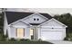 Charming single-Gathering home with gray siding, white trim, and a two-car garage at 457 White Magnolia St, Moncks Corner, SC 29461