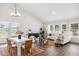 Bright and airy living room with dining area, vaulted ceiling, and lots of windows at 457 White Magnolia St, Moncks Corner, SC 29461