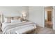 Serene bedroom featuring a cozy bed, neutral decor, soft lighting, and carpeted floors for a comfortable retreat at 457 White Magnolia St, Moncks Corner, SC 29461