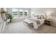 Inviting bedroom with a plush bed, soft linens, bedside tables, and large windows offering plenty of natural light at 457 White Magnolia St, Moncks Corner, SC 29461