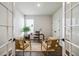 Bright home office with a desk, chairs, natural light, and a neutral color scheme creating a calm, productive workspace at 457 White Magnolia St, Moncks Corner, SC 29461