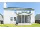 The back of this home features a screened-in porch for enjoying the weather and a well kept yard at 5007 Ballantine Dr, Summerville, SC 29485