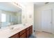 Bright bathroom with a large mirror, double sinks and access to the tub and shower at 5007 Ballantine Dr, Summerville, SC 29485