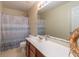 Bathroom features a light colored tile floor, sink, and bathtub with shower at 5007 Ballantine Dr, Summerville, SC 29485
