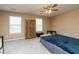 Neutral bedroom features a ceiling fan, carpet and two windows for ample natural light at 5007 Ballantine Dr, Summerville, SC 29485