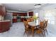 Eat-in kitchen with stainless appliances, dark wooden cabinets, and adjacent dining area at 5007 Ballantine Dr, Summerville, SC 29485