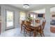 Bright dining room with views to the living room and out to the screened in porch at 5007 Ballantine Dr, Summerville, SC 29485