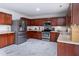 Modern kitchen with stainless steel appliances, wooden cabinets, and sleek countertops at 5007 Ballantine Dr, Summerville, SC 29485