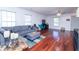 Spacious living room with hardwood floors, large windows, and comfortable gray sectional sofa at 5007 Ballantine Dr, Summerville, SC 29485