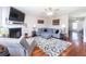 Cozy living room with a fireplace, plush gray sectional sofa, and hardwood floors at 5007 Ballantine Dr, Summerville, SC 29485