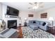 Cozy living room with a fireplace, plush gray sectional sofa, and hardwood floors at 5007 Ballantine Dr, Summerville, SC 29485