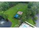 Aerial view of a playground, soccer field, and community pool shaded by a blue awning at 5007 Ballantine Dr, Summerville, SC 29485
