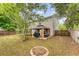 Large backyard featuring a gazebo, fire pit, and privacy fence at 708 Professor Dr, Ladson, SC 29456