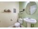 Half bath with pedestal sink, updated fixtures, and decorative accents at 708 Professor Dr, Ladson, SC 29456