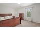 Bedroom featuring a dark wood bedroom set, neutral carpet and light gray walls at 708 Professor Dr, Ladson, SC 29456