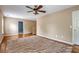 Bright bedroom featuring hardwood floors, ceiling fan, and view to the upstairs landing at 708 Professor Dr, Ladson, SC 29456