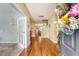 Inviting entryway featuring hardwood floors, an open floor plan, and a decorative wreath on the front door at 708 Professor Dr, Ladson, SC 29456