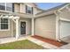 Close up on the front door and covered porch with tasteful decorations and a welcoming sign at 708 Professor Dr, Ladson, SC 29456