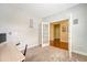 View of a spacious home office with French doors, neutral paint, and a view to the hall at 708 Professor Dr, Ladson, SC 29456