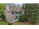 Exterior of the home with a screen porch, patio, and lush greenery at 7920 Parklane Ct # 608, North Charleston, SC 29418