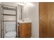 Modest bathroom features neutral tones, standard fixtures, and shelving at 7920 Parklane Ct # 608, North Charleston, SC 29418