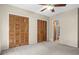 Bright bedroom leads to bathroom; has neutral carpet, and a double closet at 7920 Parklane Ct # 608, North Charleston, SC 29418