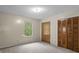 Cozy bedroom features neutral carpet, bright window, and a double closet at 7920 Parklane Ct # 608, North Charleston, SC 29418